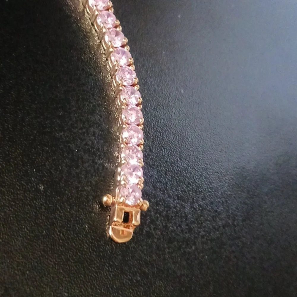Elegant Gold Tone Bracelet with Pink Stones